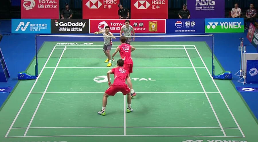 4 people playing doubles