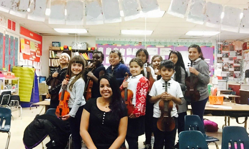 Skarli with her students