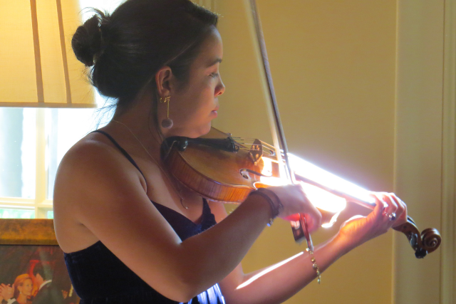 Skarli playing violin