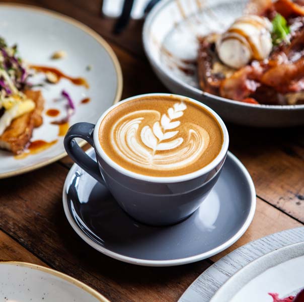Espresso coffee on an bed of coffee beans