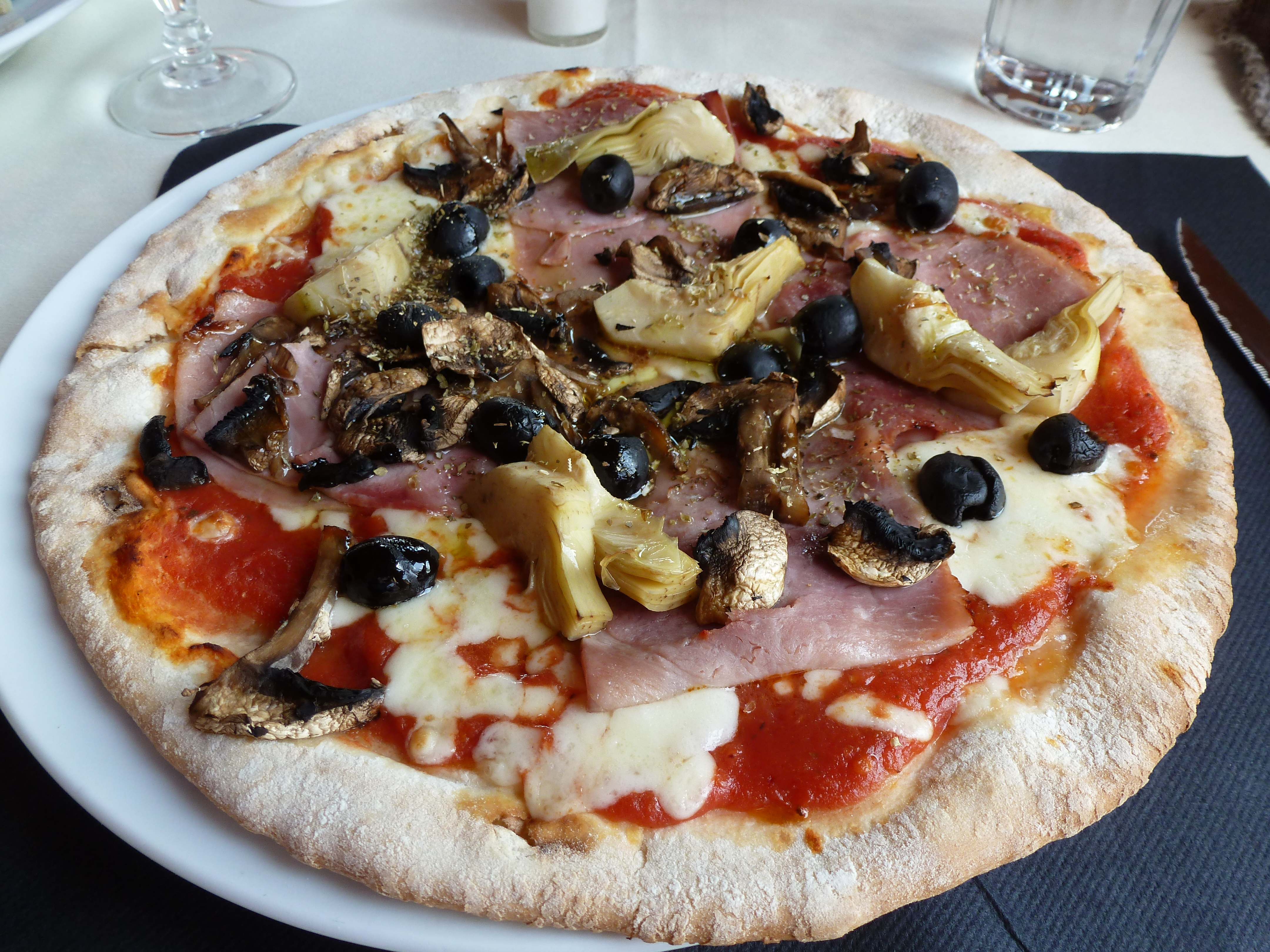 photo of delicious Capricciosa pizza