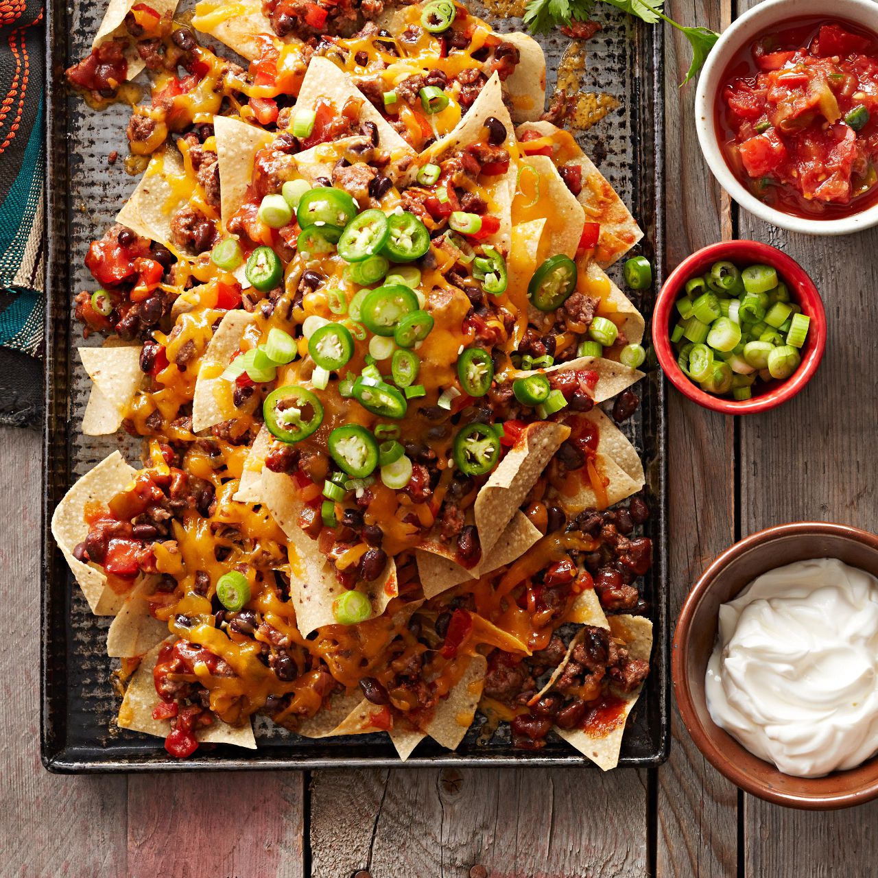 cheesey nachos with jalepenos on top