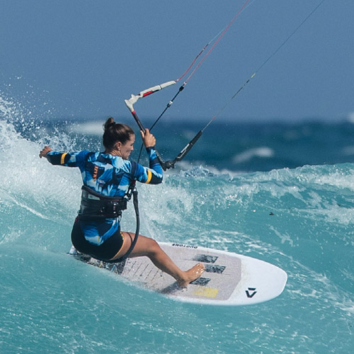 Kitesurfing girl wave