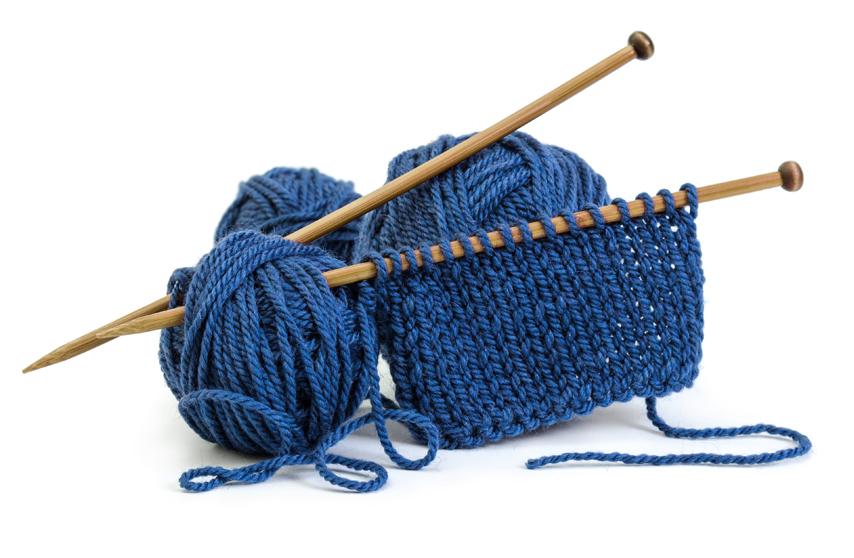 knitting needles inside ball of yarn