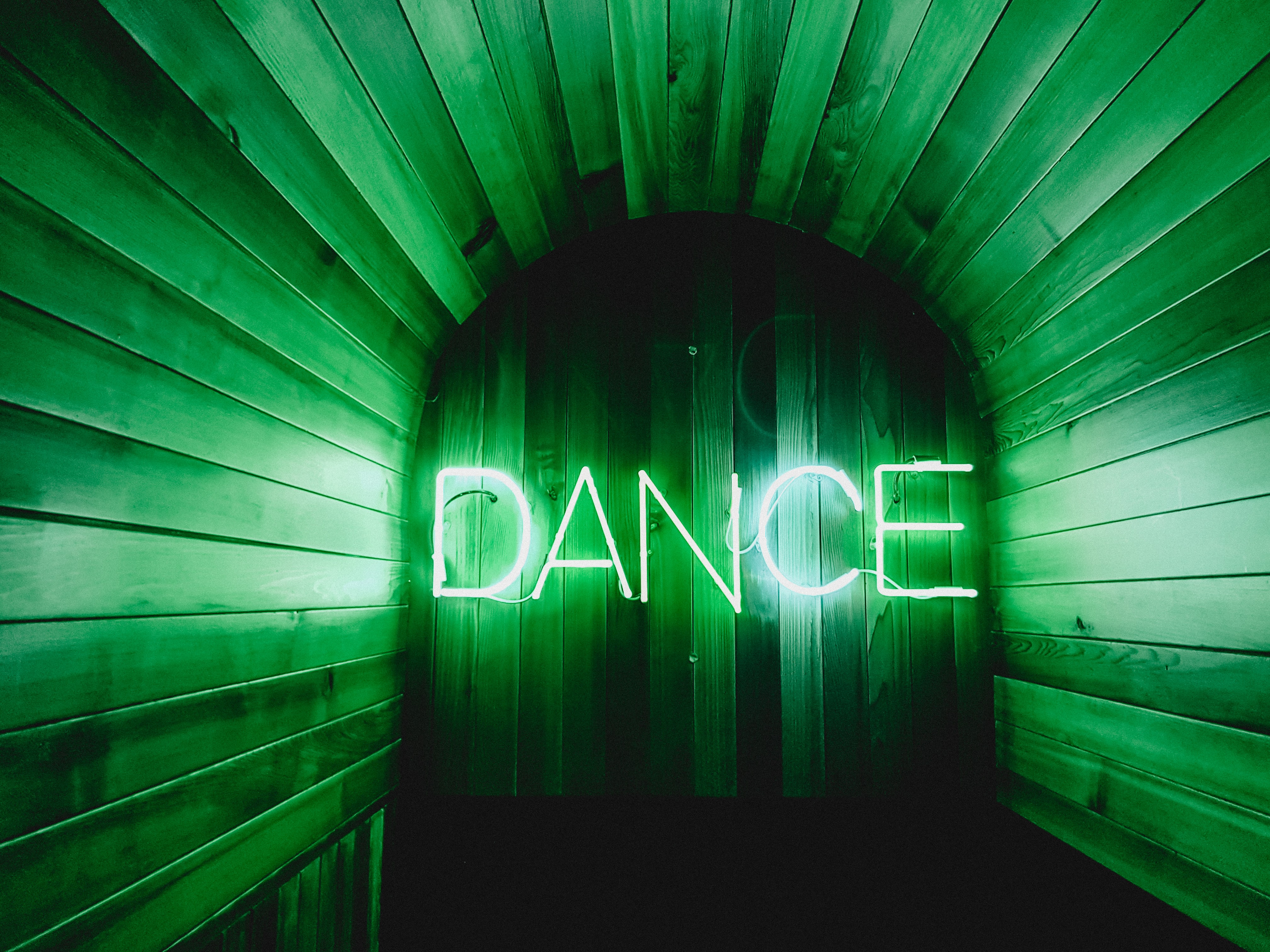 the word dance in neon lights
