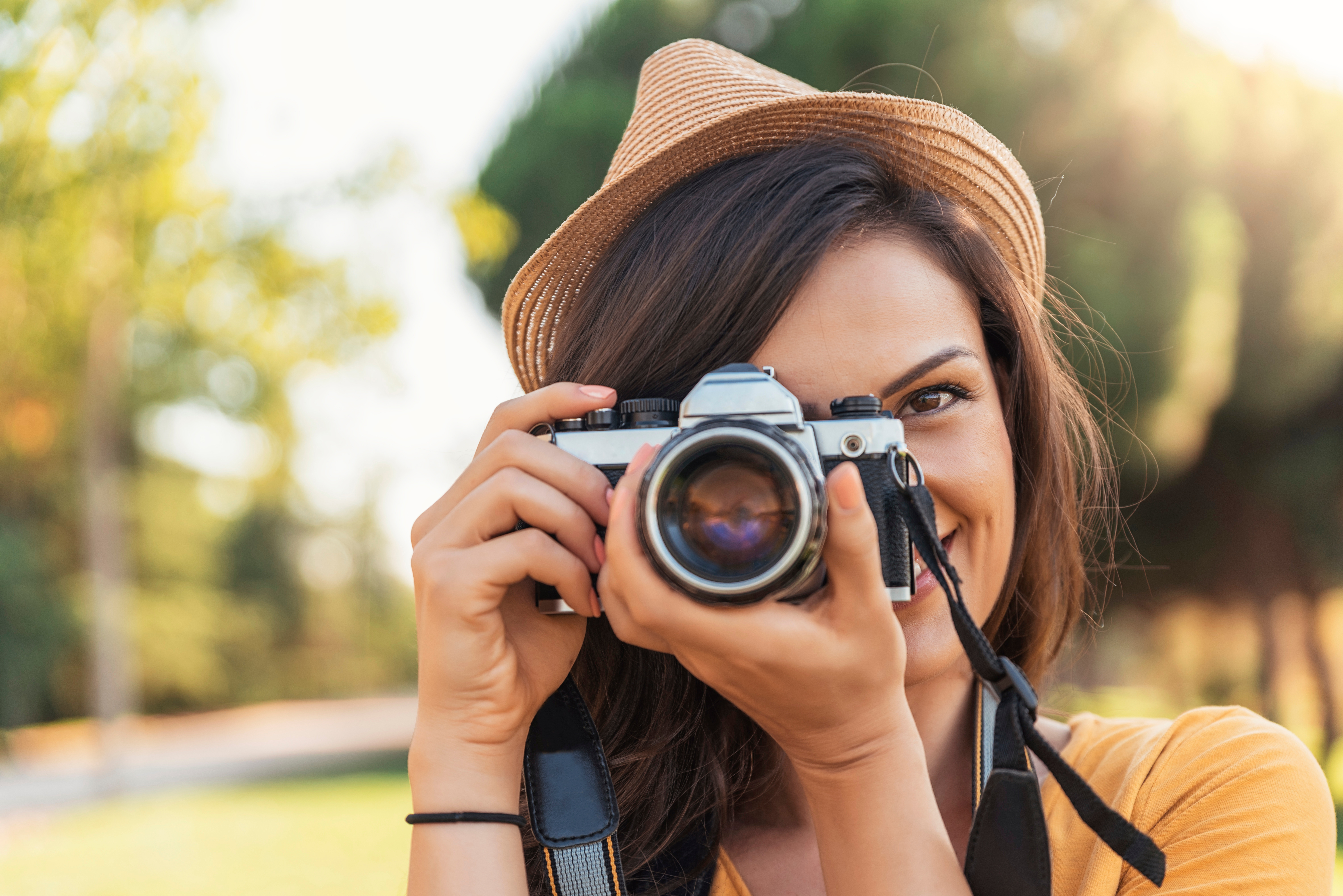 woman taking pictures with camera