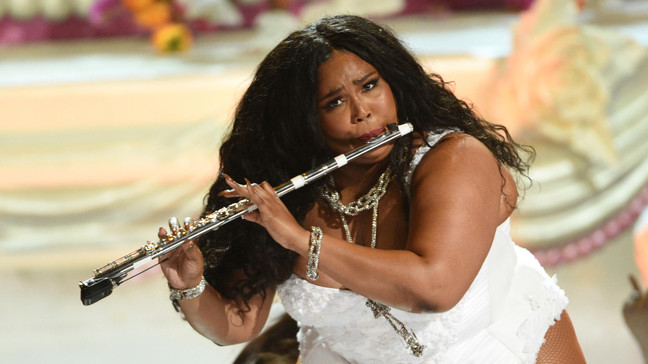 Lizzo playing flute