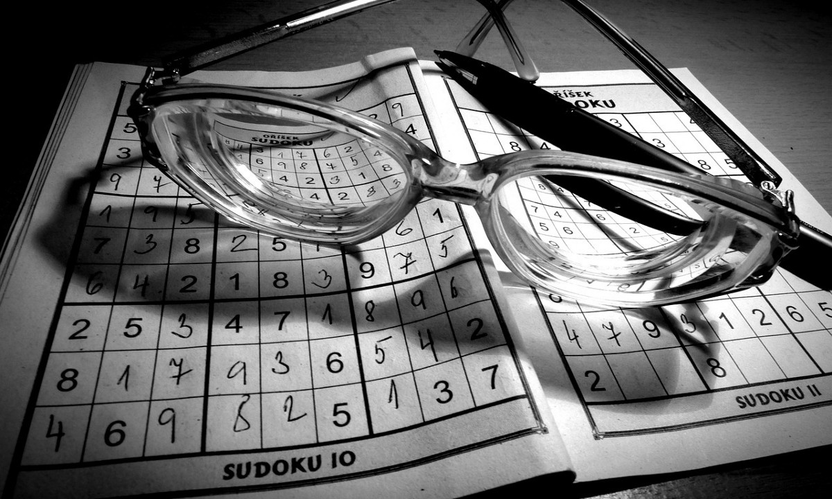 a sudoku and glasses