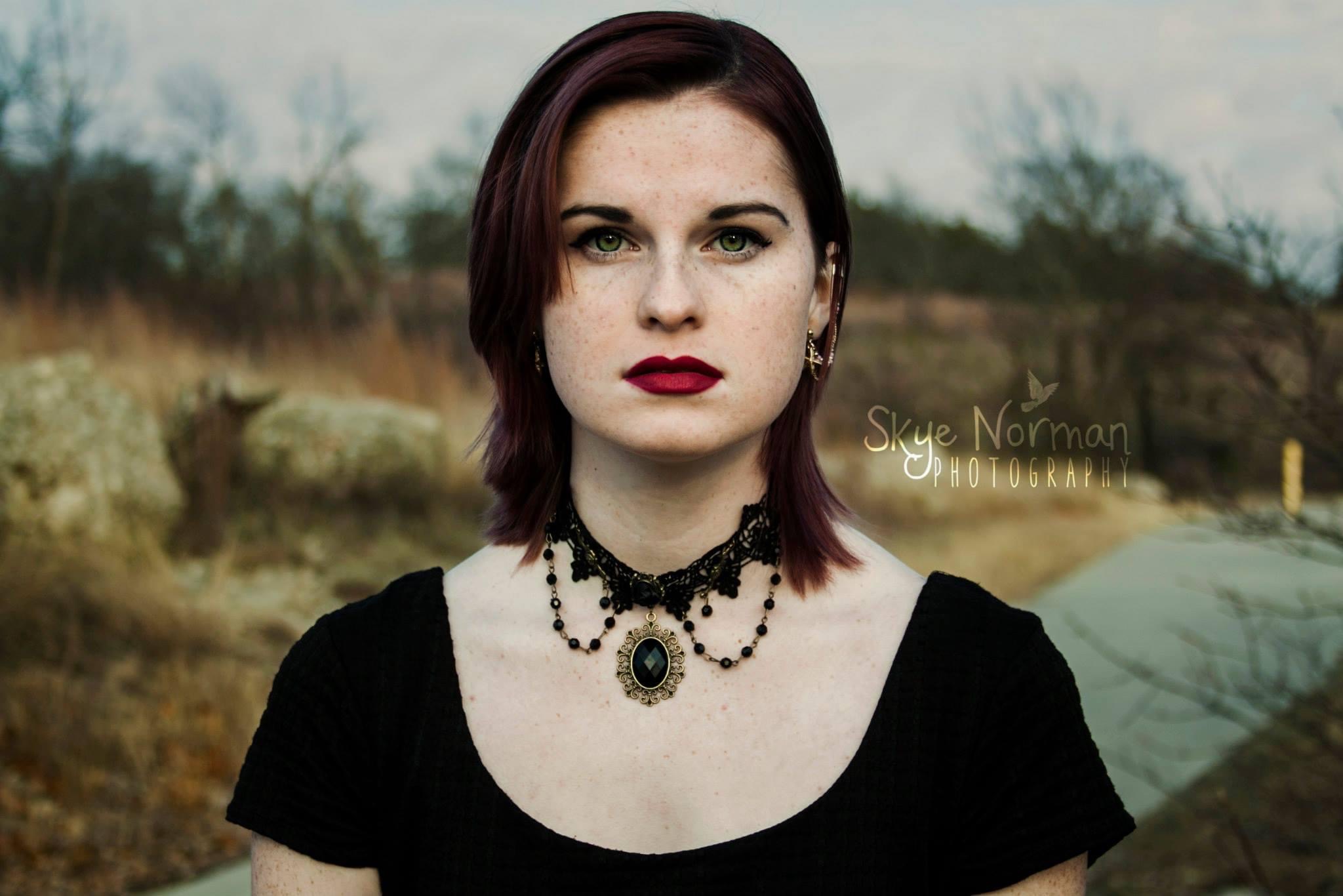 girl facing straightforward with stoic expression