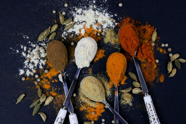 Five spoons holding spices