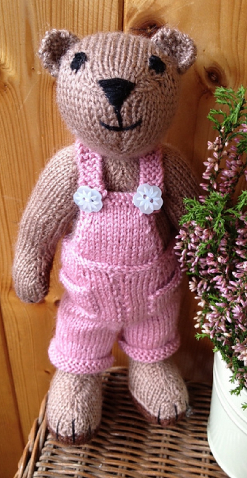 Knitted bear in pink dungarees