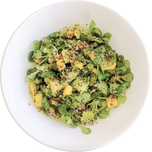 white plate full with the ingredients for the salad.
    The salad itselt.