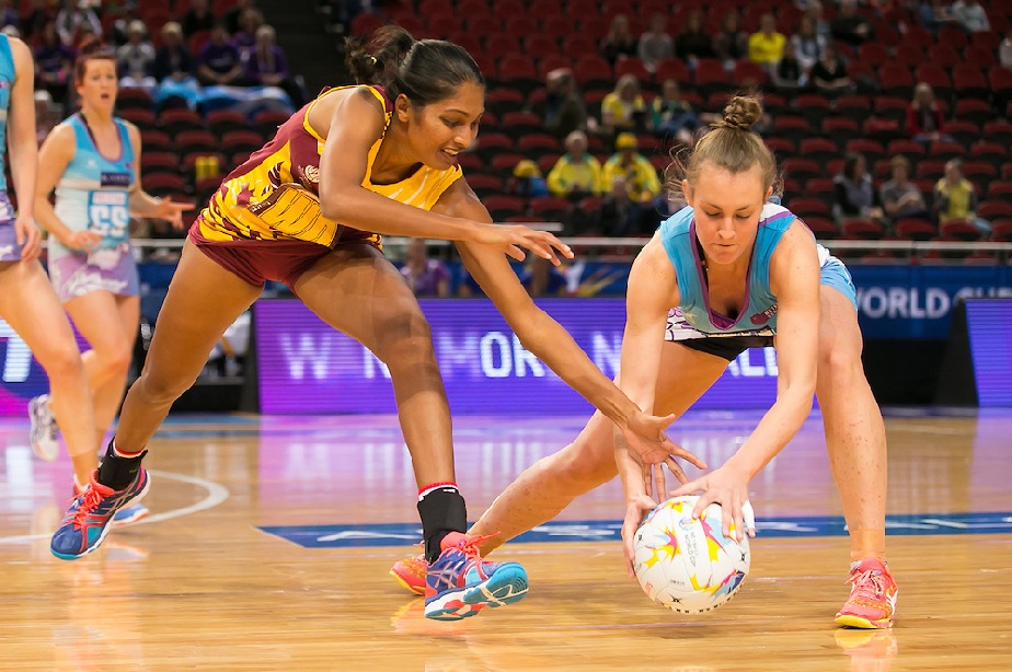 Two players fight for a groundball