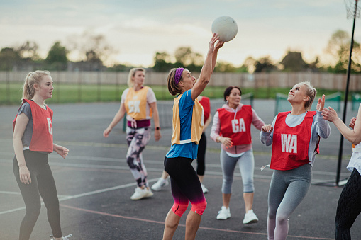 social netball game at sunset