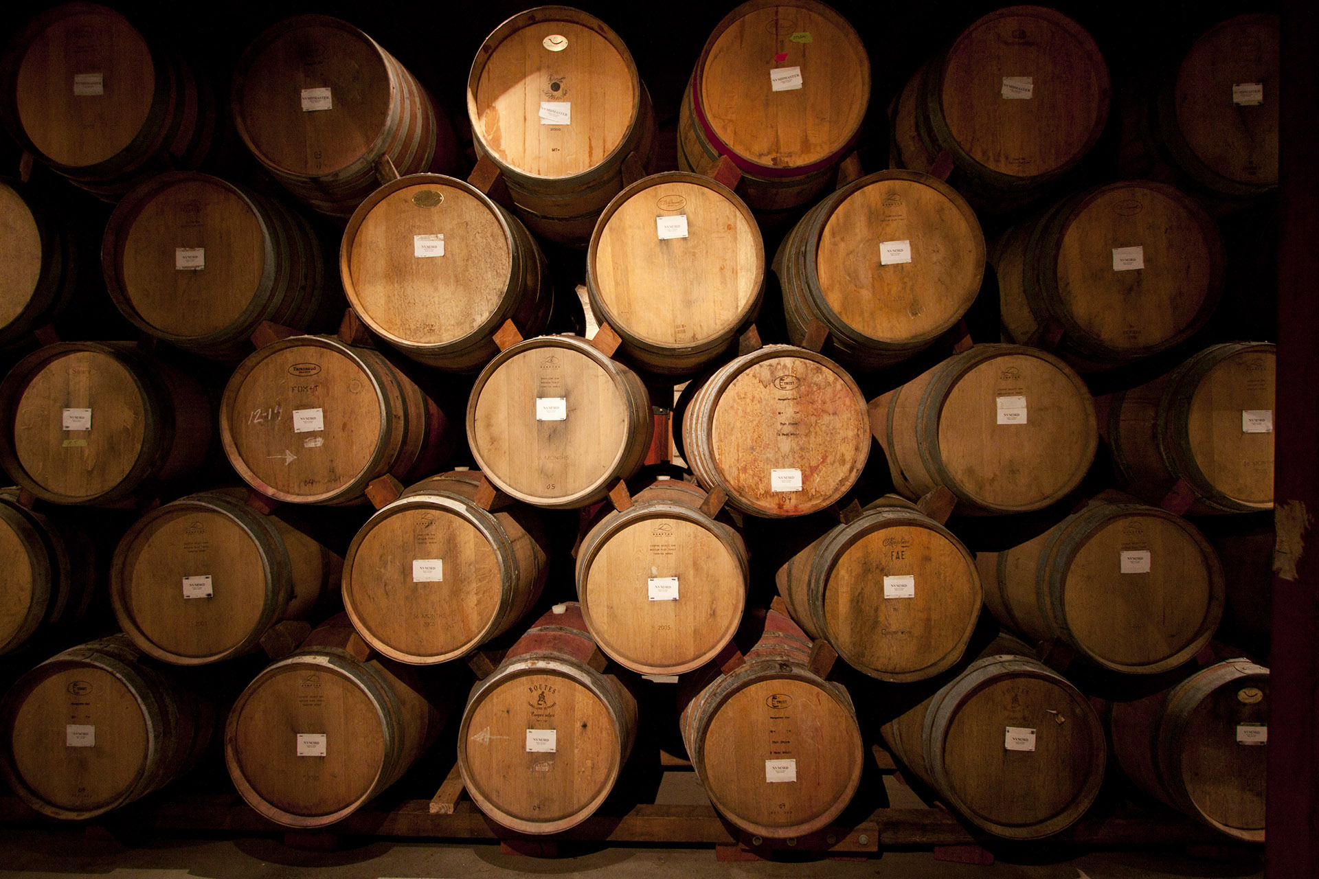 oak barrels stacked for ageing of wine