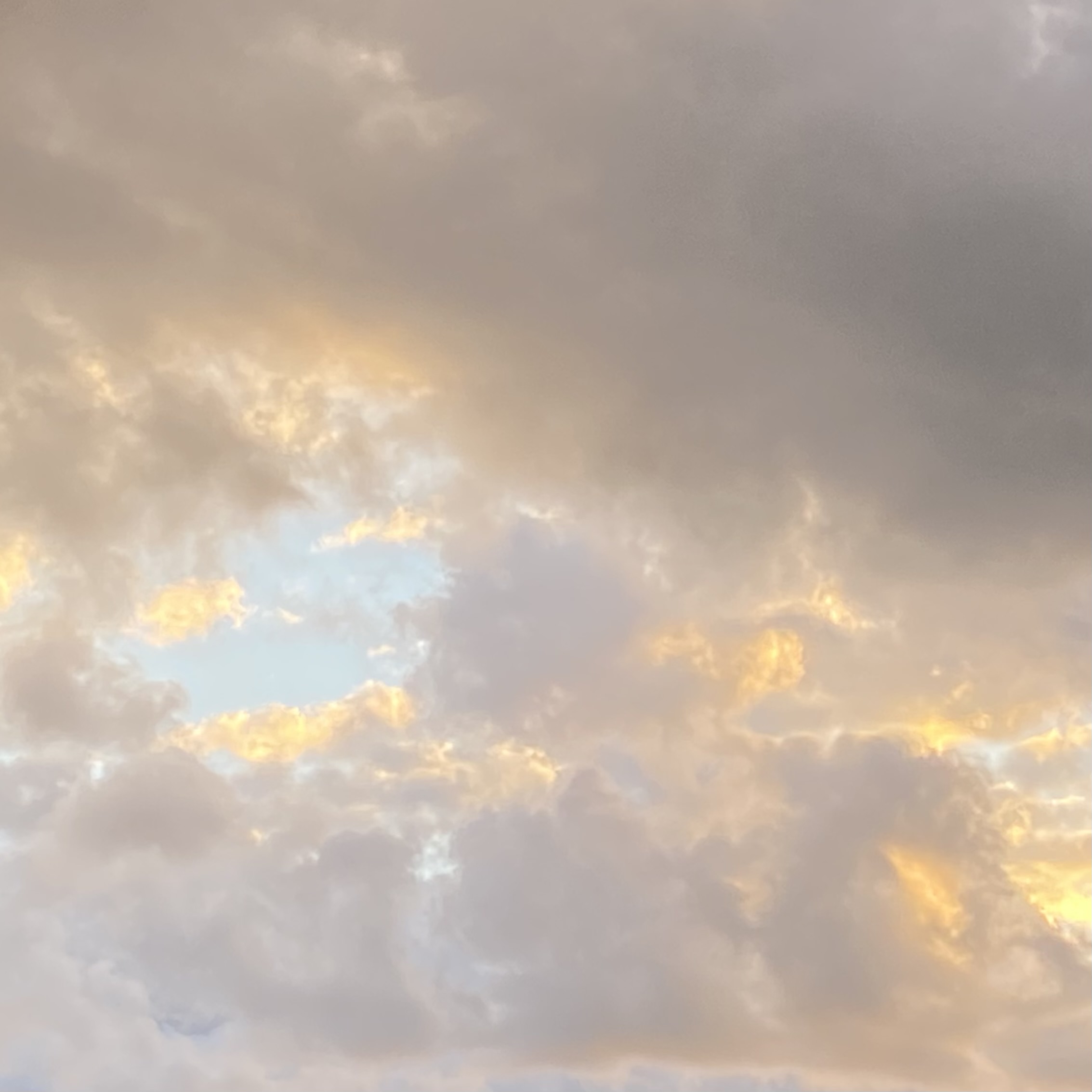 Fluffy clouds at sunrise