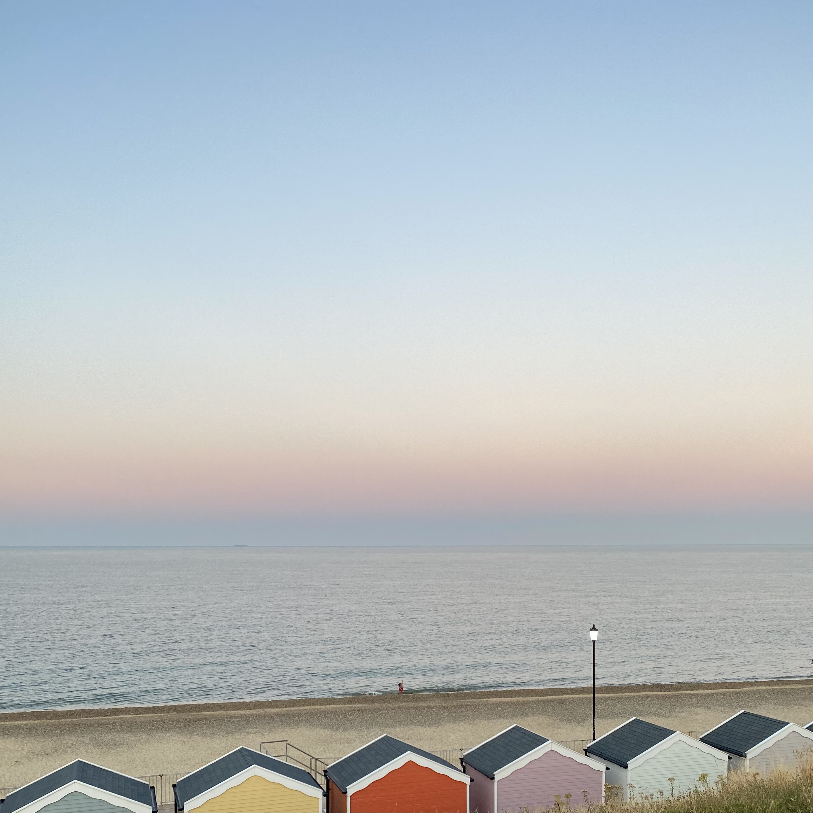 Pastel, cloudless sky at sunset