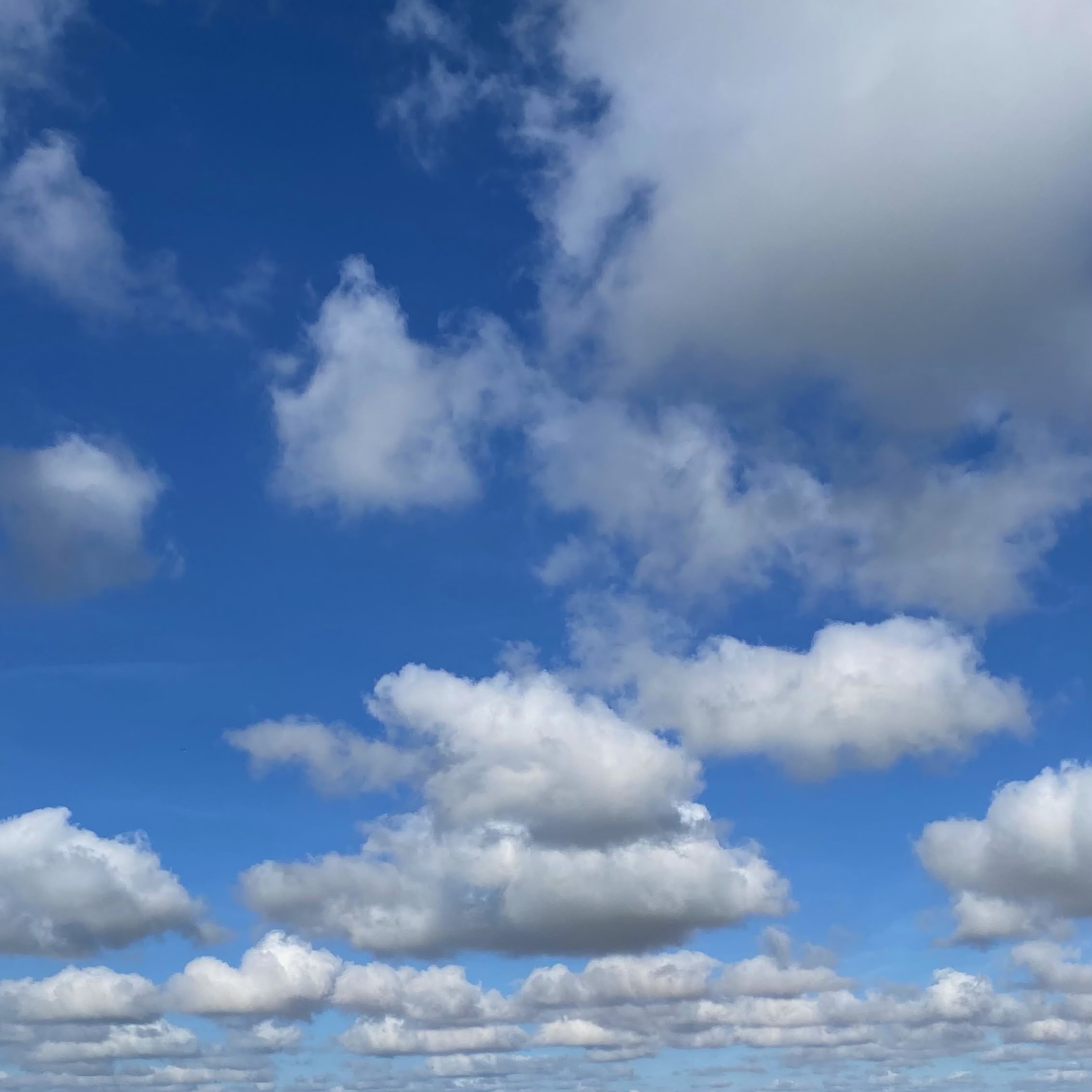 Fluffy clouds on blue sky