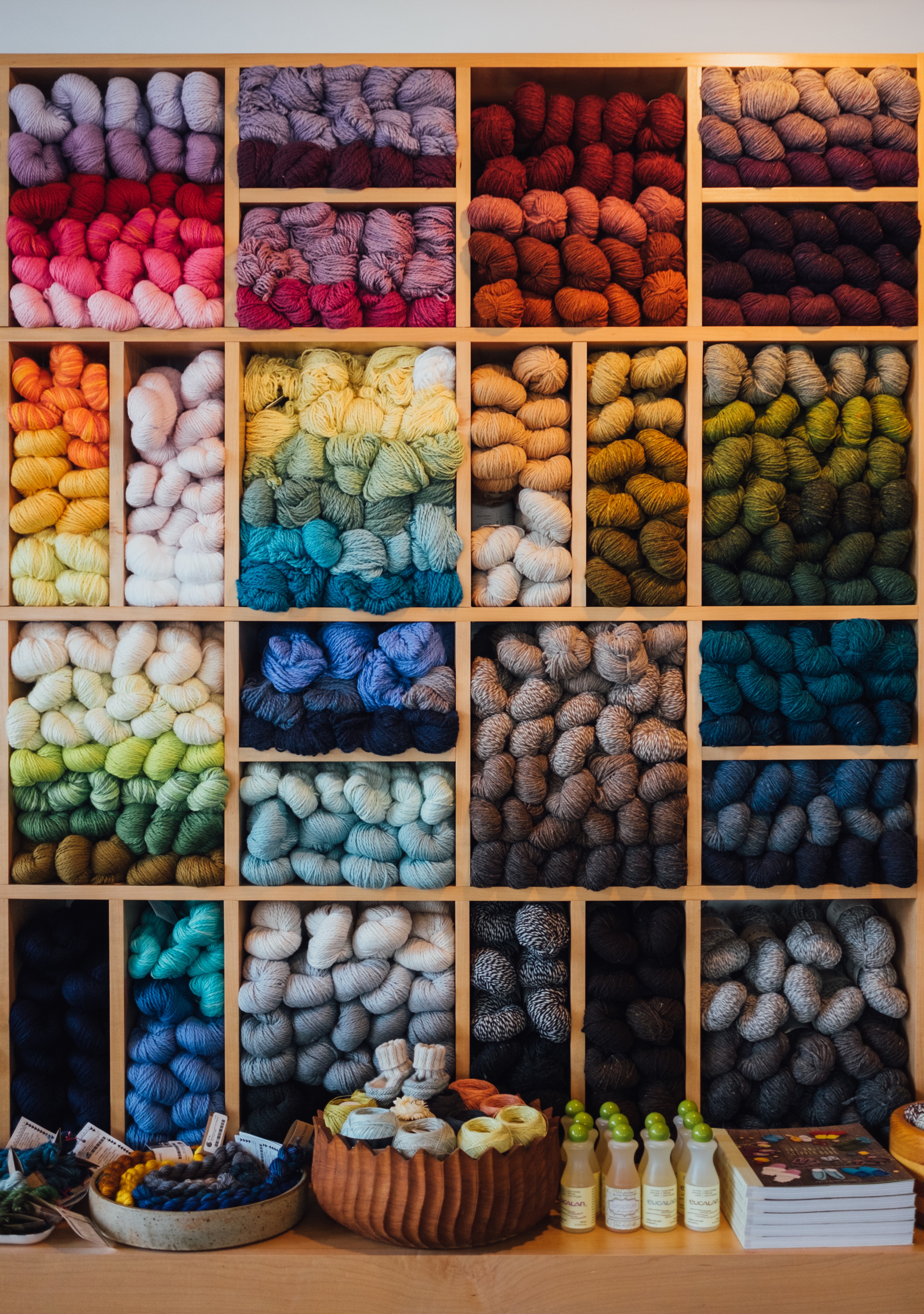 wall of yarn arranged in a gradient rainbow