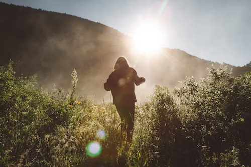 A girl running in the woods
