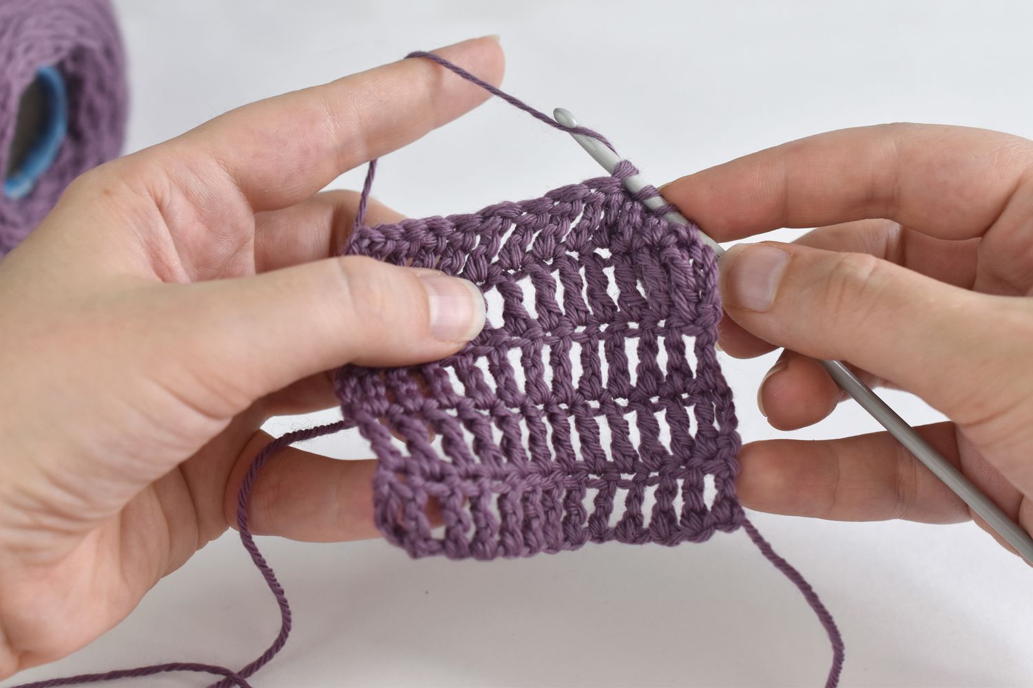 a woman crocheting