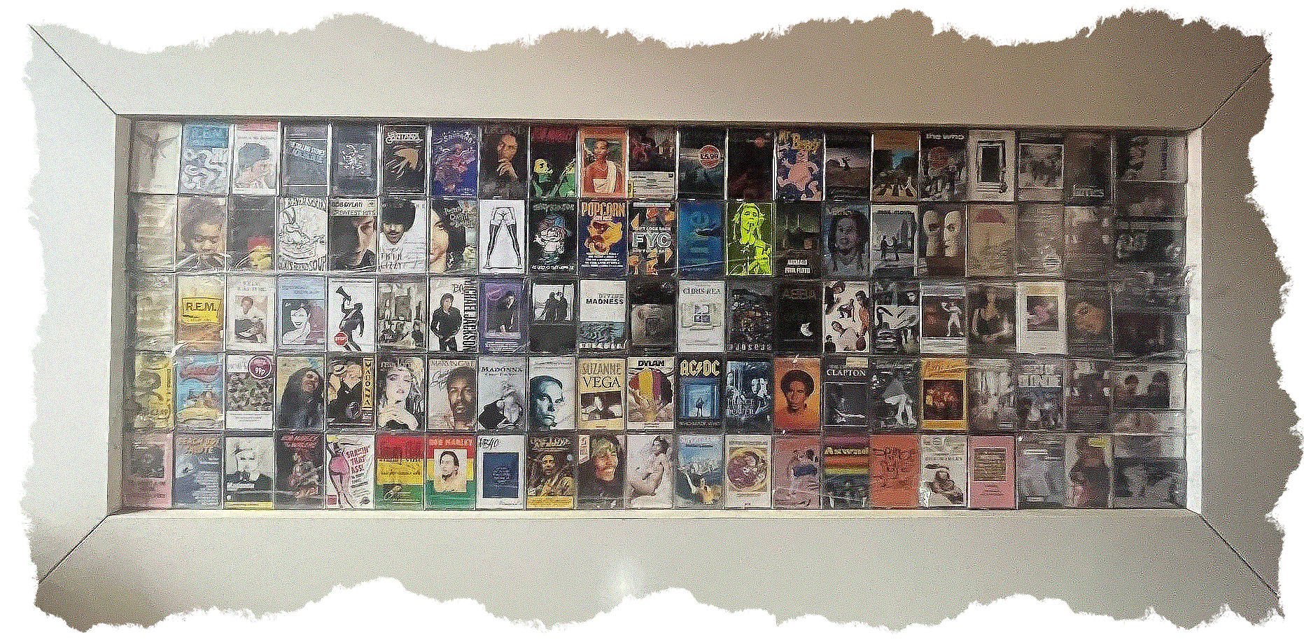 A frame filled with over 100 cassettes
