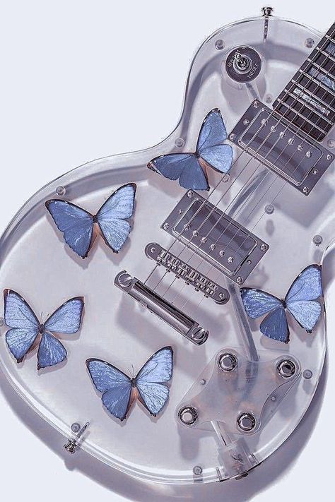 image of clear electric guitar with blue butterflies inside