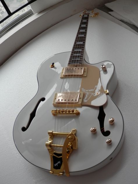 image of white base guitar