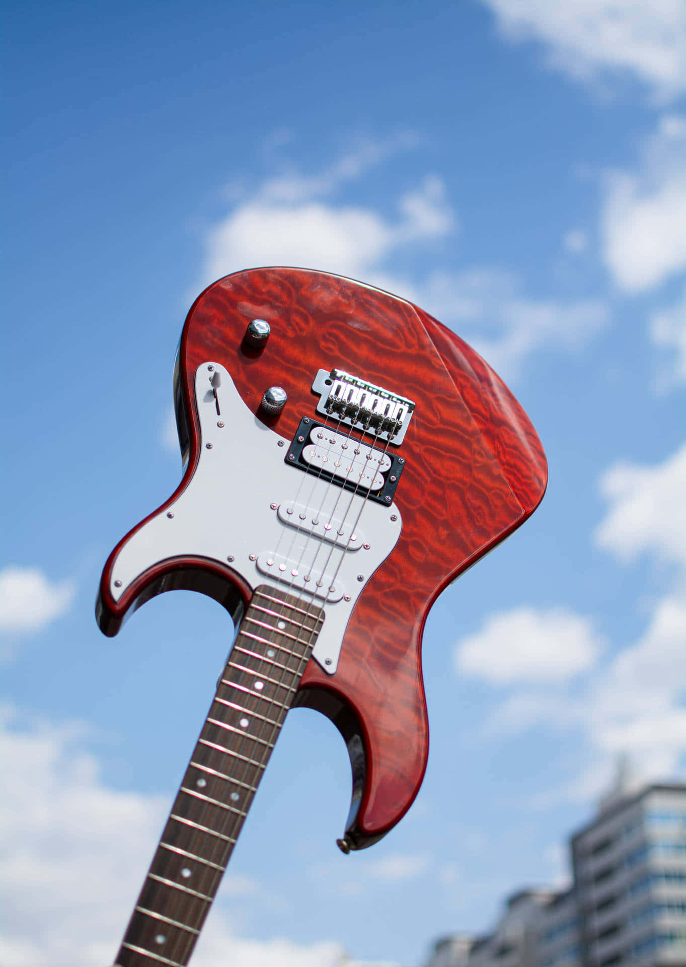 Red electric guitar outside