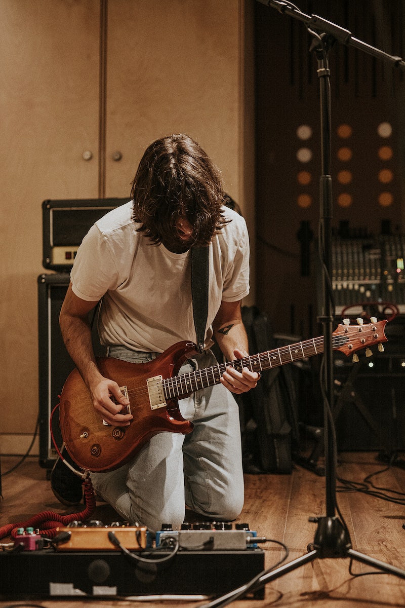 man playing electric guitar