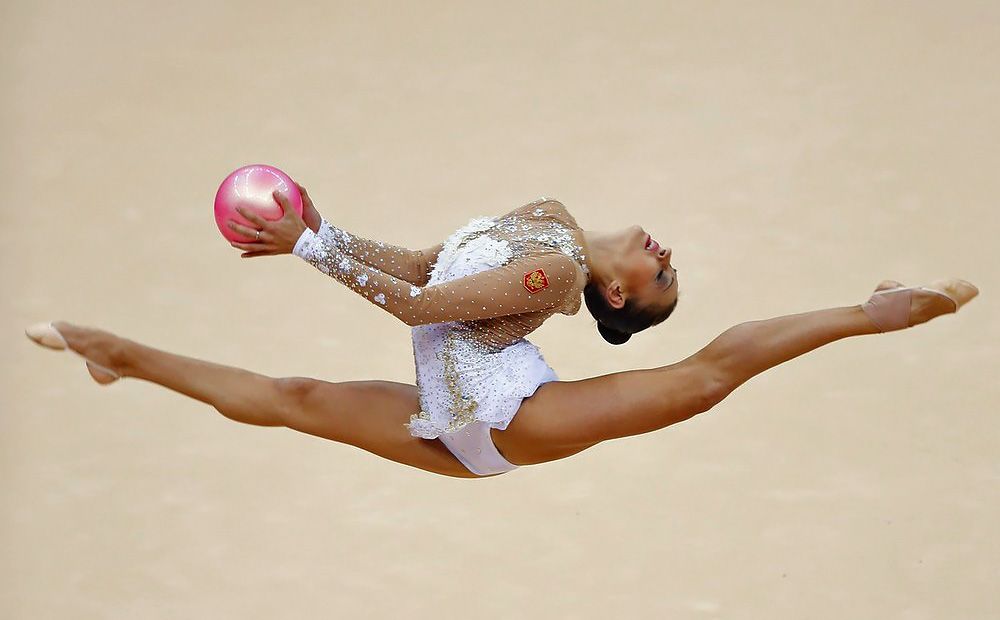 Gymnast performing a high-level split leap