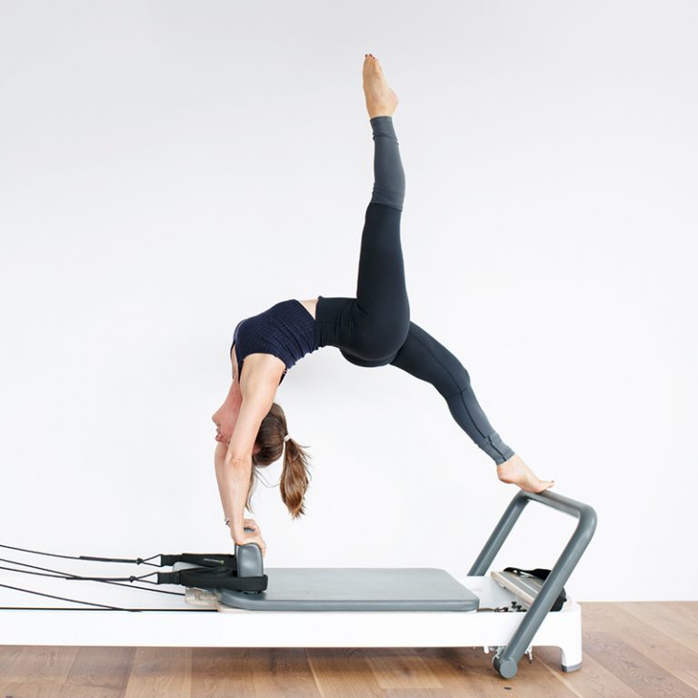 Woman on a Pilates reformer