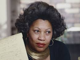 Middle aged Toni Morrison staring past the camera with a legal pad in
    hand