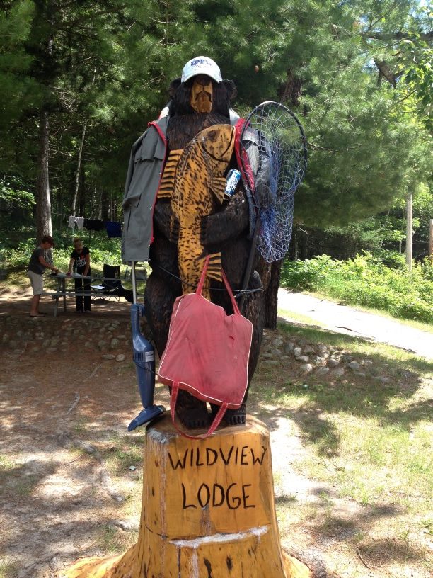 Wooden-Bear-holding-fishing-gear