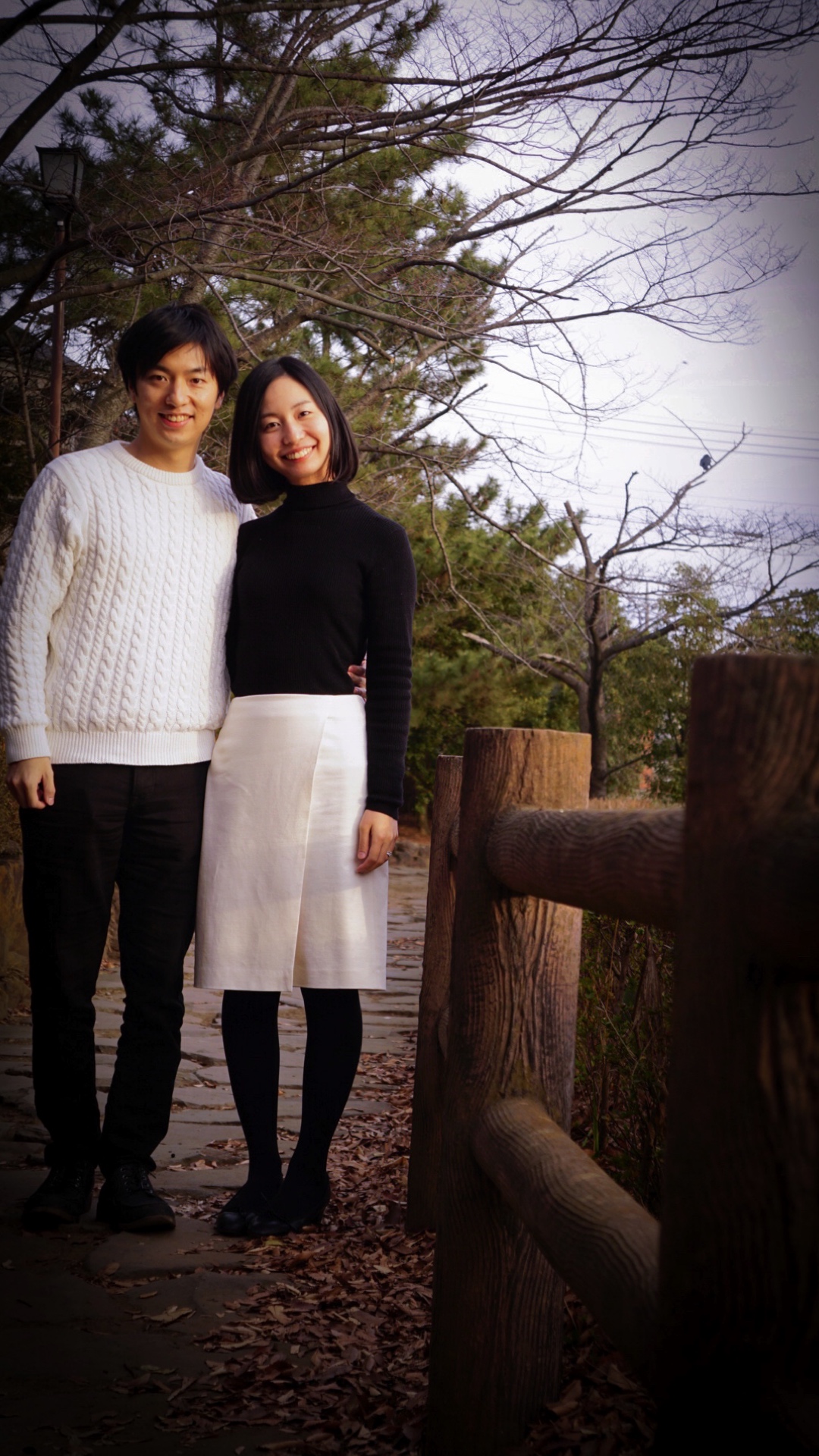 A couple posing for their prenuptial photos