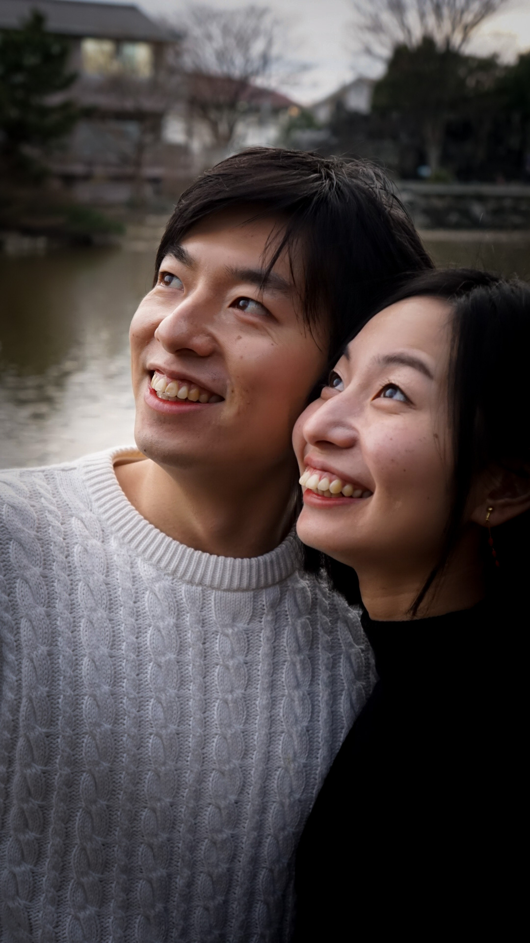 A couple posing for their prenuptial photos