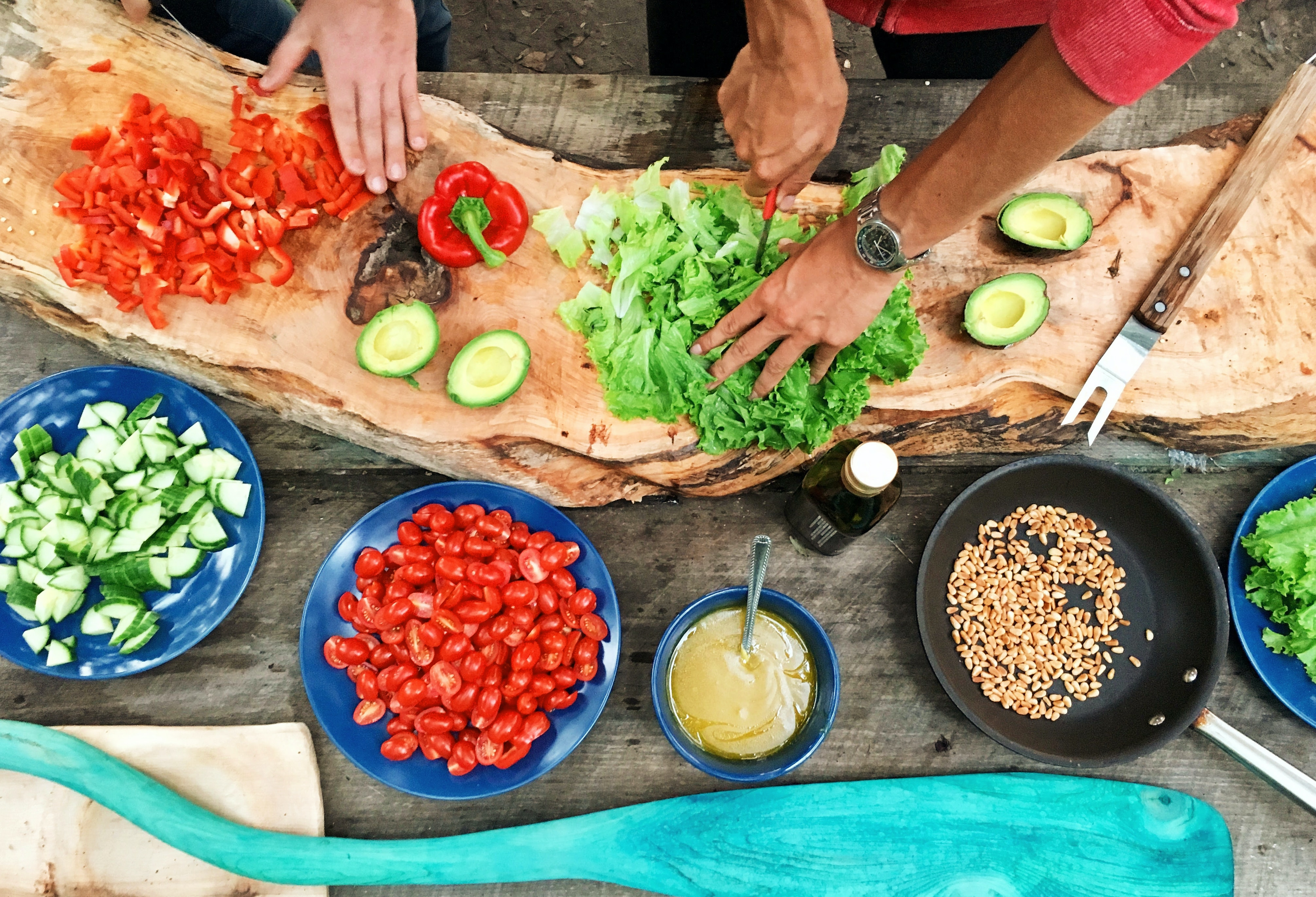 chopped ingredients on a board and bowls of prepared ingredients