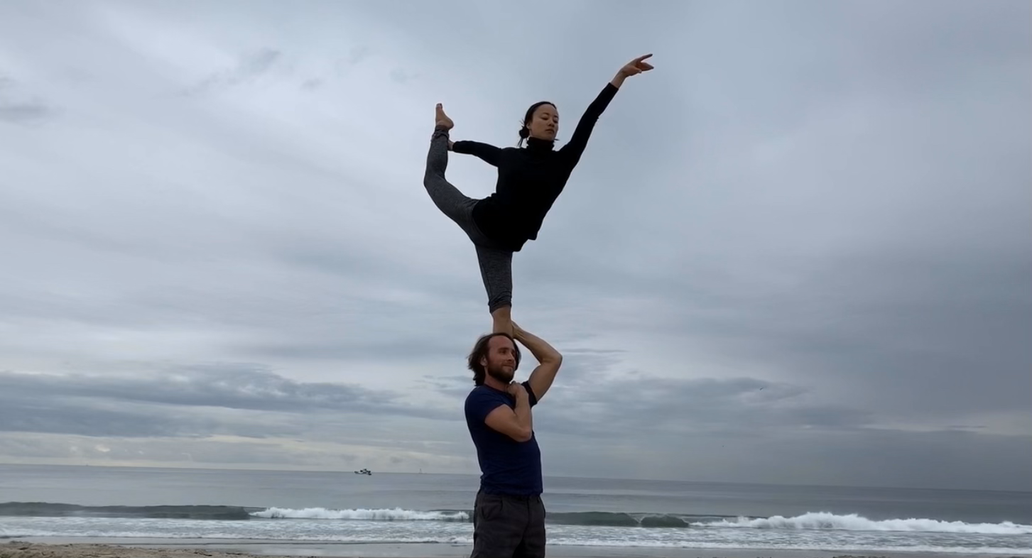 standing acroyoga graceful pose