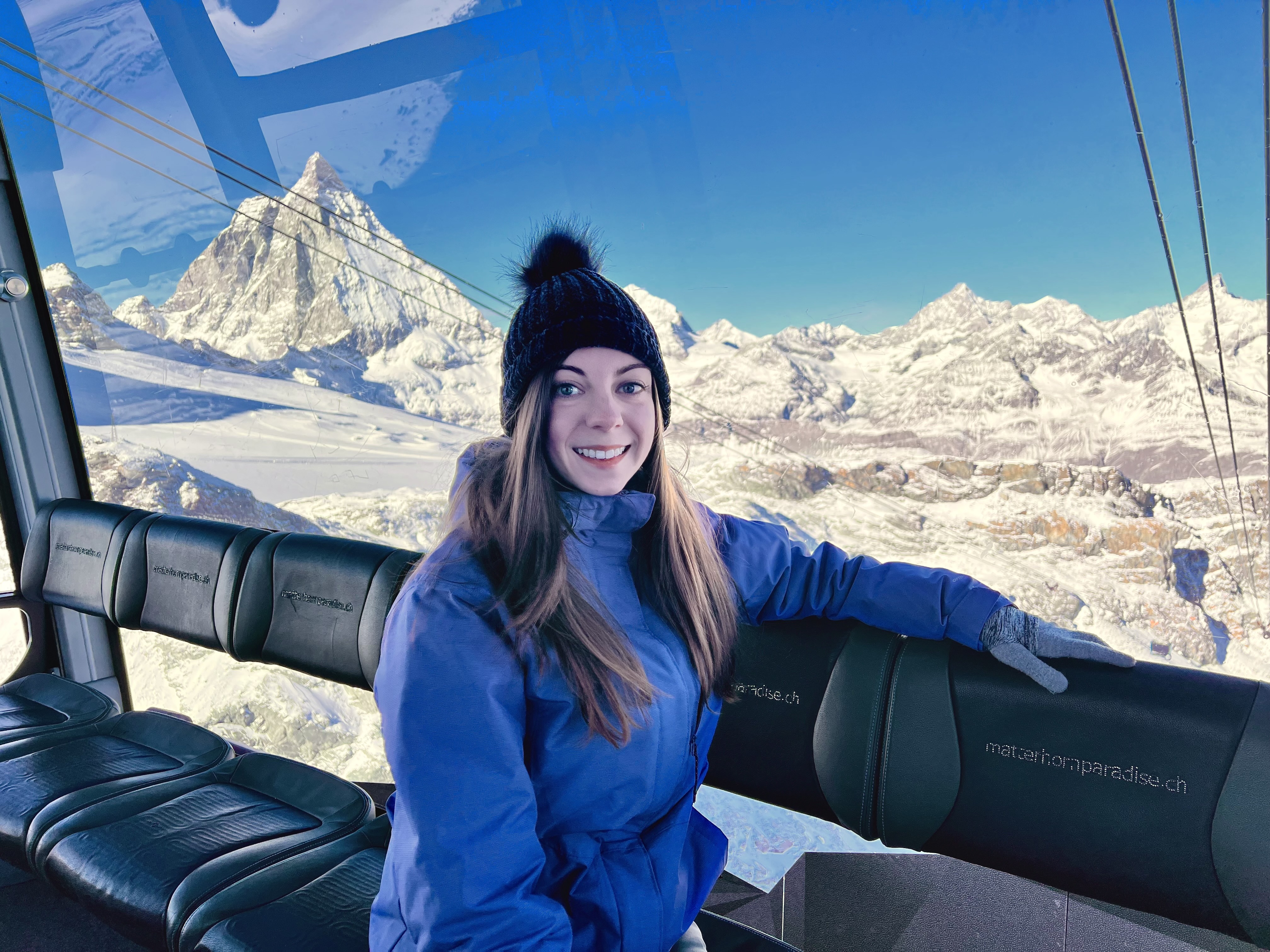 image of a girl on a gondola in the snowy Swiss Alps