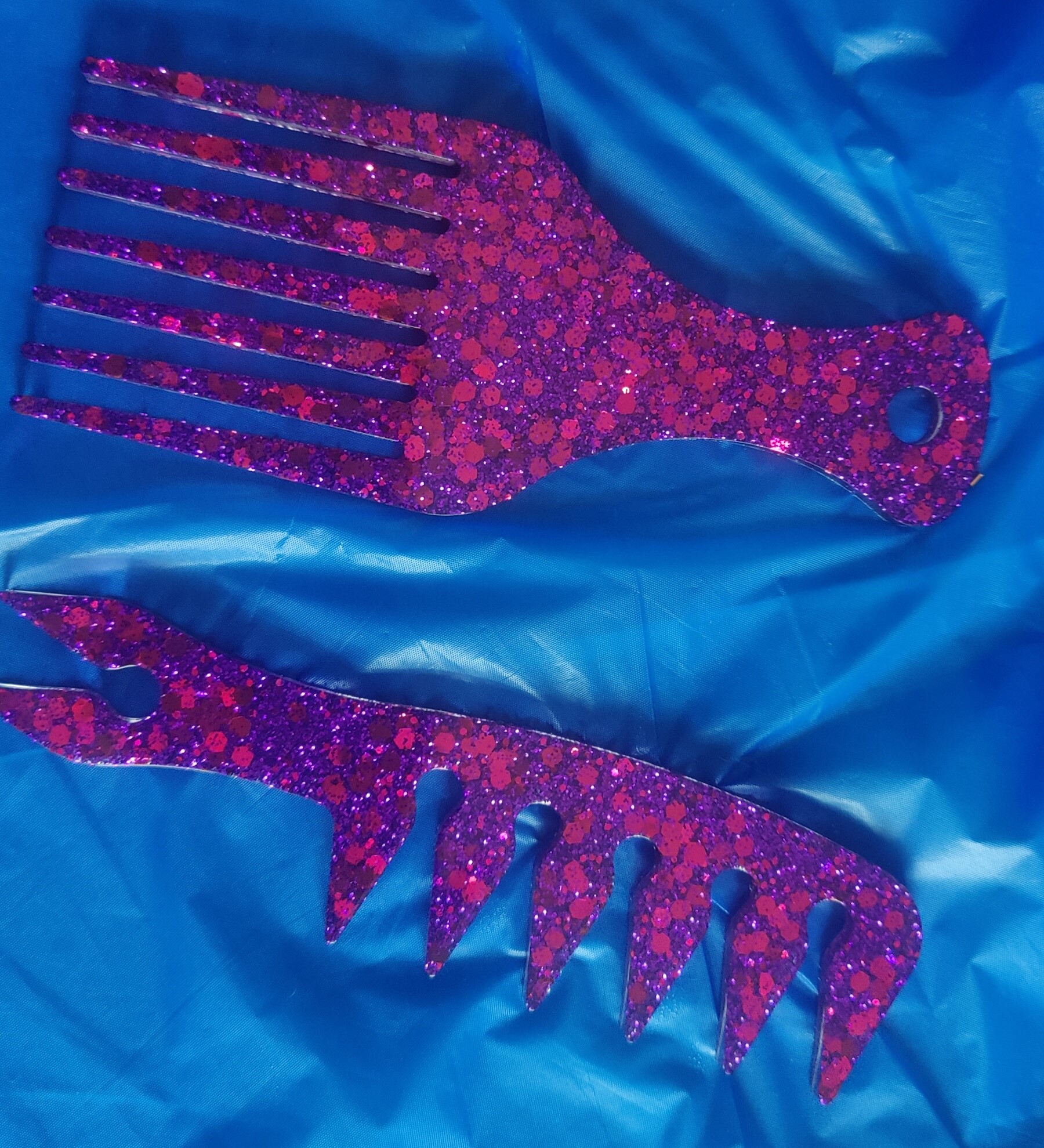 2 purple glitter combs