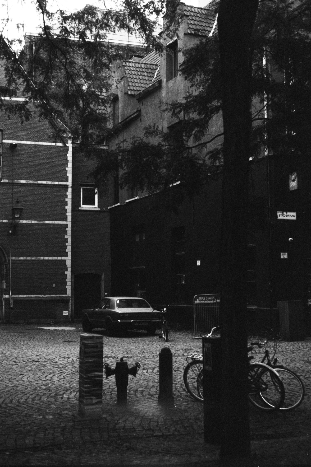 Analog city landscape with an old car