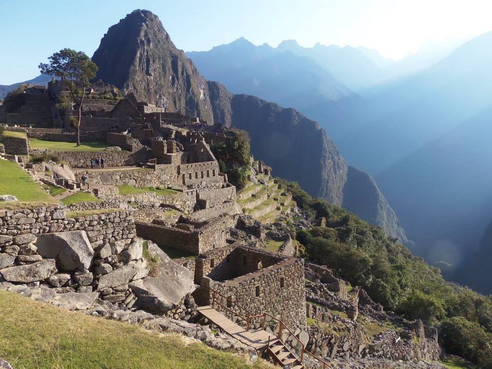 Machu Picchu architecture, green pastures, mountain