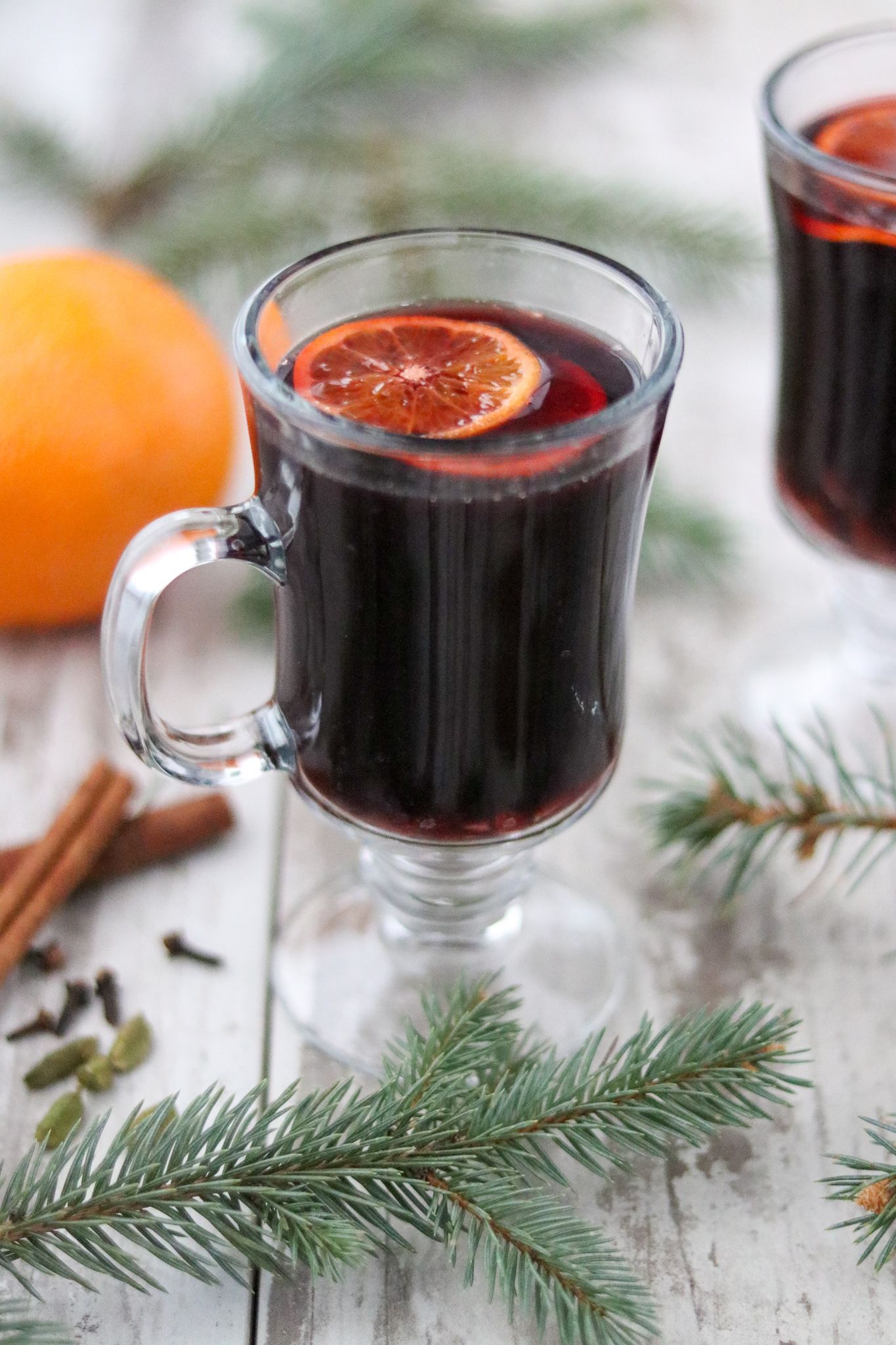 a glasses of a darkred christmas beverage