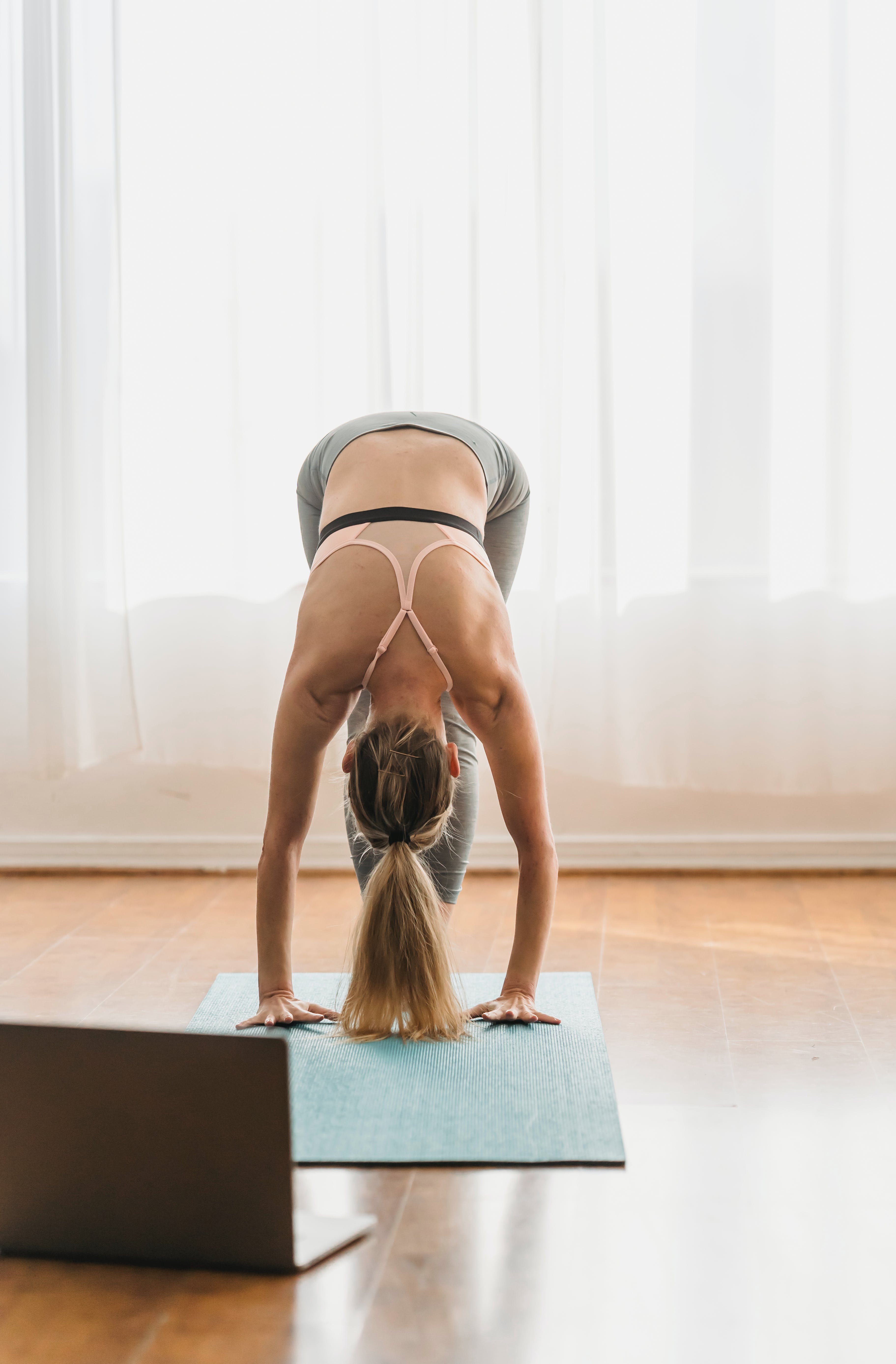 photo of a woman attending a online yoga class