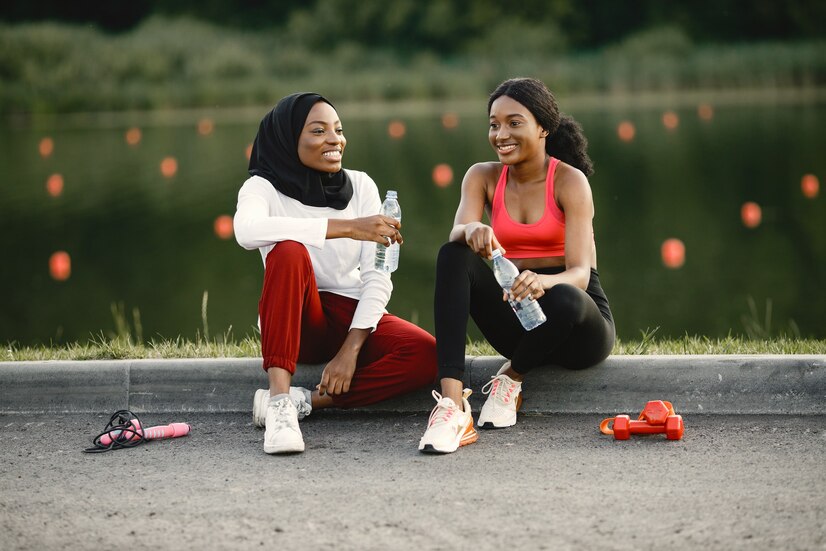 Two women resting after exercising