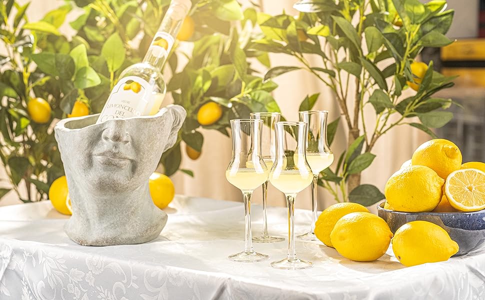 Glasses of Limoncello with lemons on the side