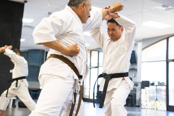 Two men practising karate self-defense