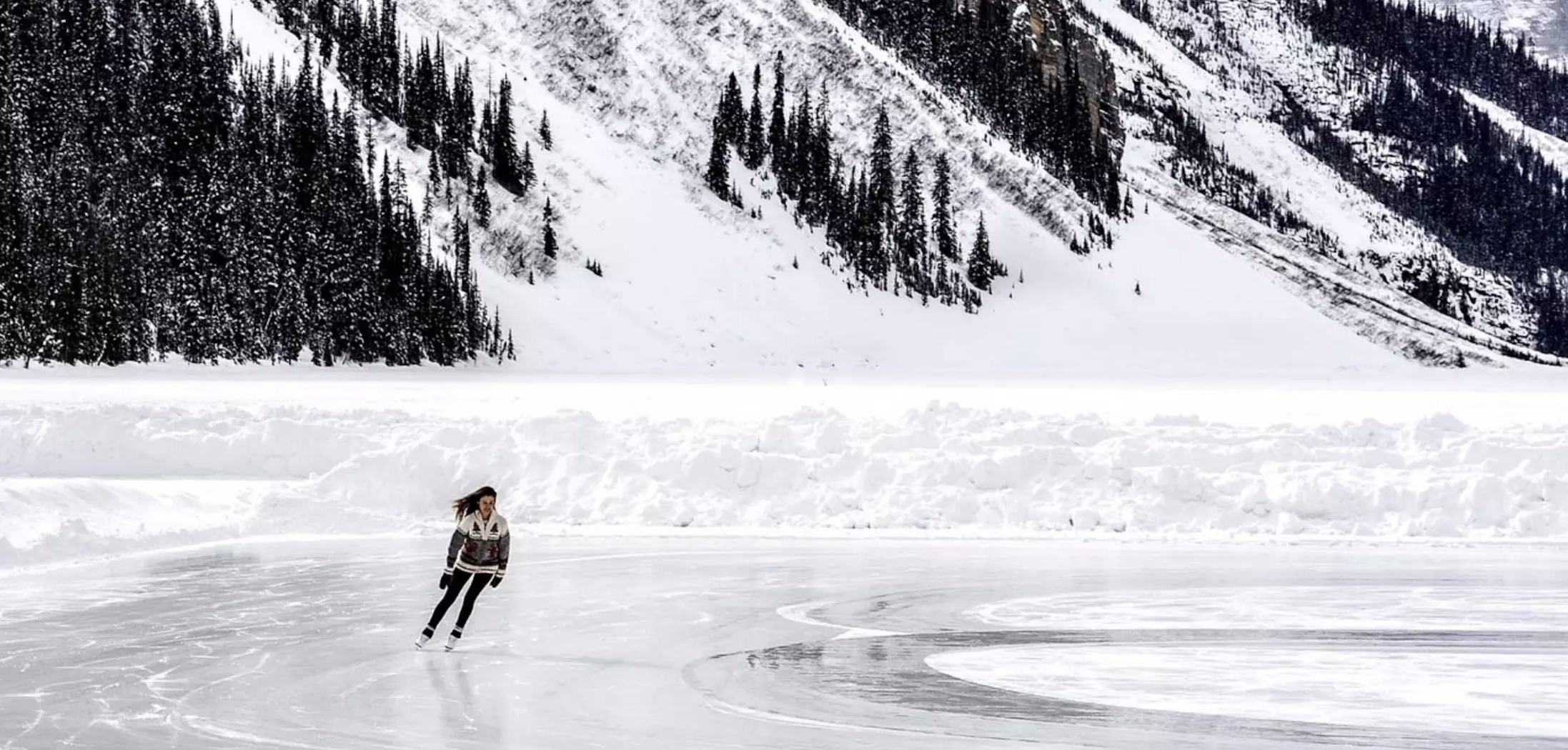 woman skating on a frozen pond