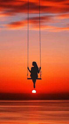 girl on a swing in sunshine 