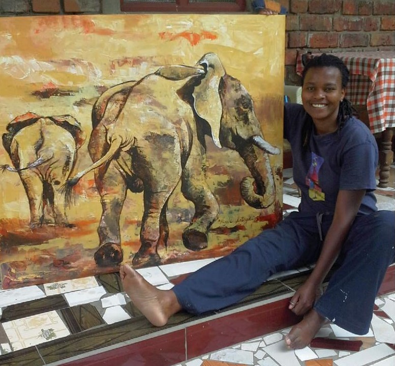Riziki Kateya with her elephant oil painting